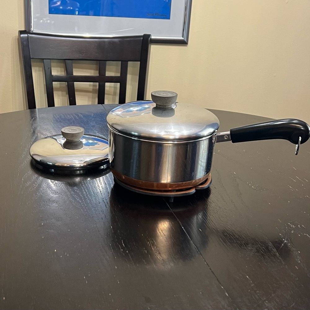 Revere Ware 2-quart saucepan copper-clad bottom and stainless steel body.
